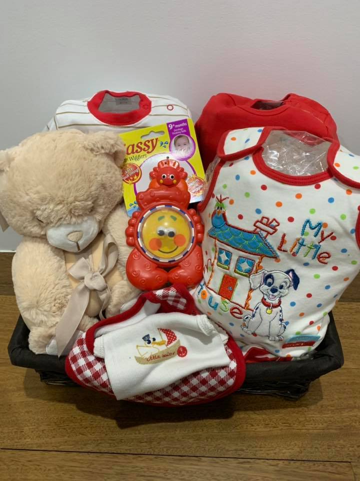 Red and white unisex baby gift basket