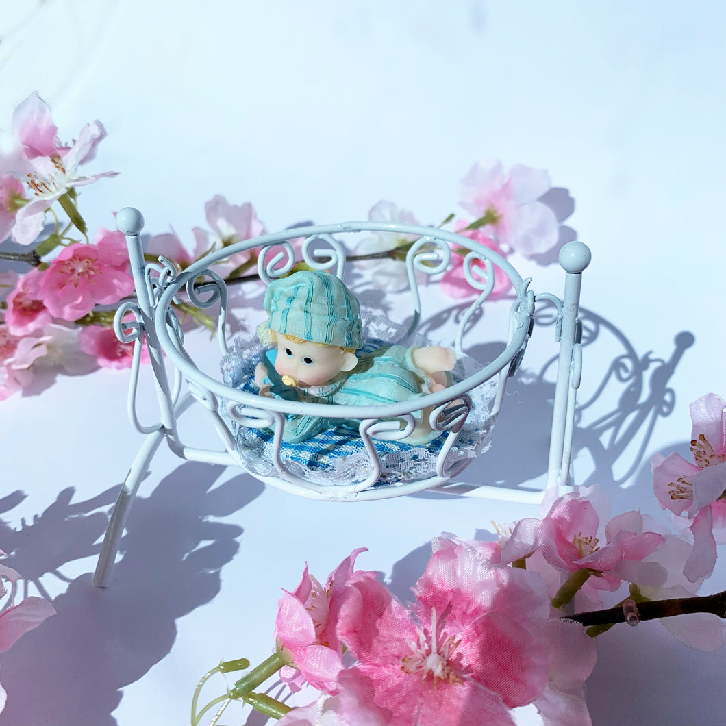 Blue baby in cradle